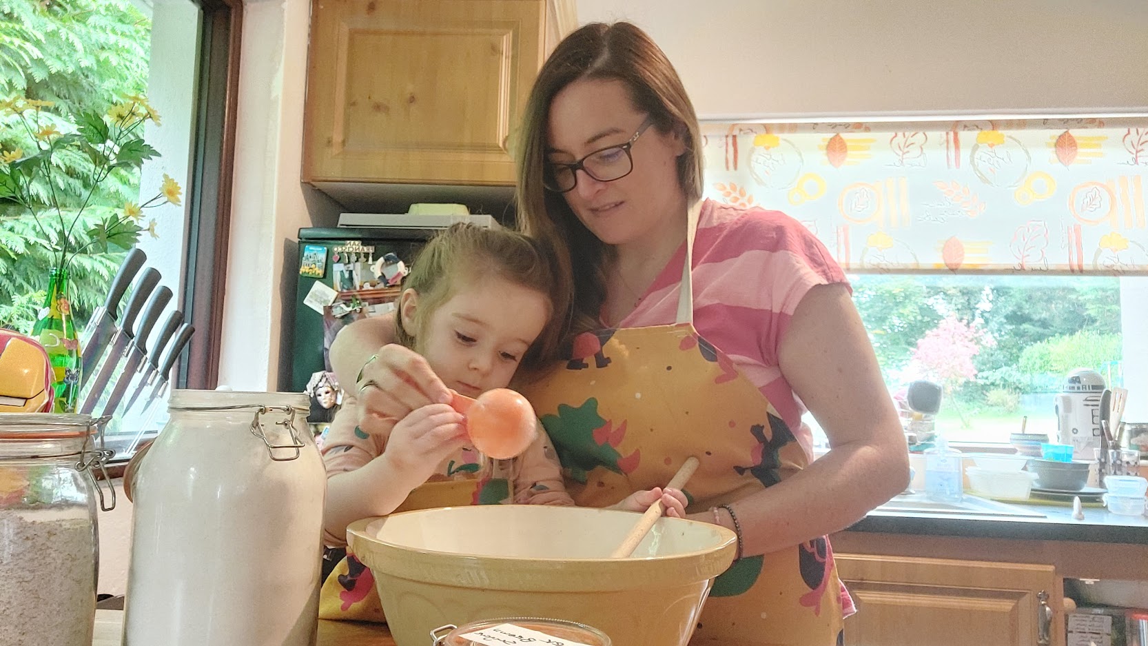 Image of women and child making cakes