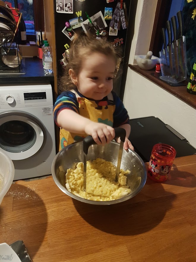Girl mashing up bananas